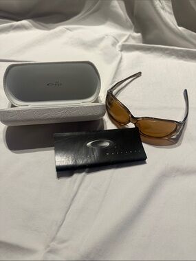 Oakley Amber Lens Translucent Brown Frame Sunglasses with White Case